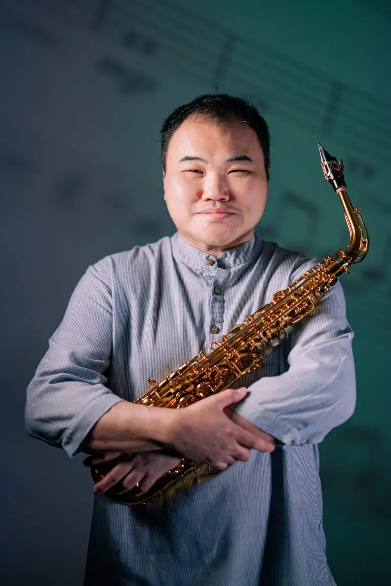Leslie Wong Musician with Saxophone