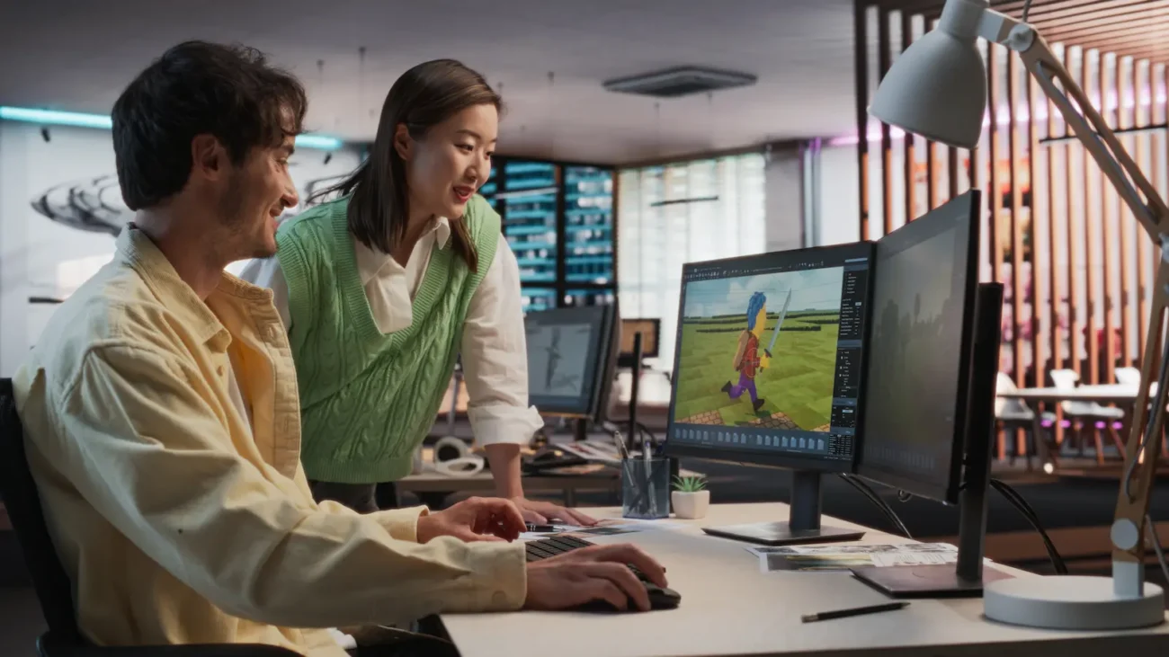A woman discussing business innovation and management with a game developer.